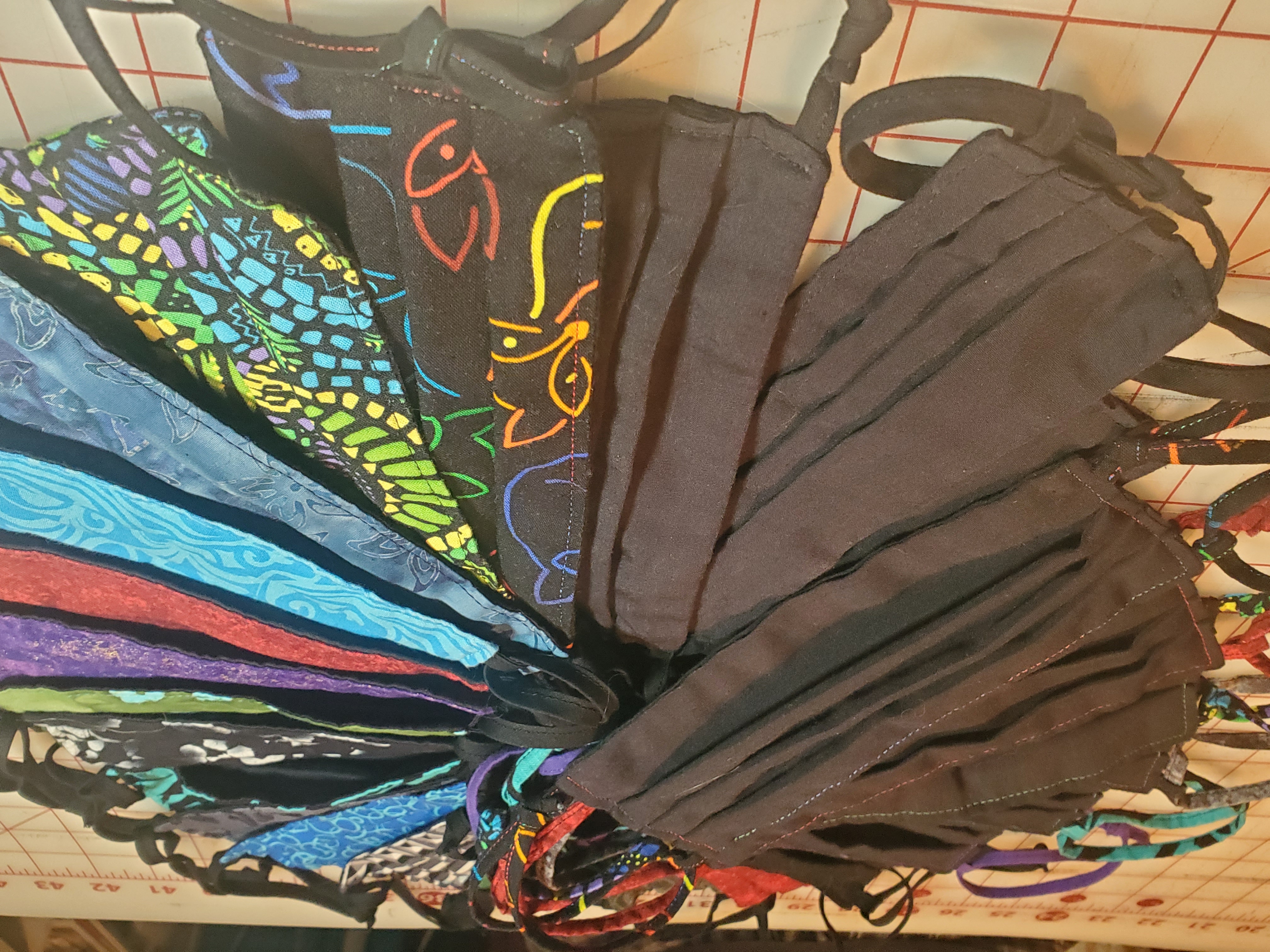 A pile of face masks in various colors